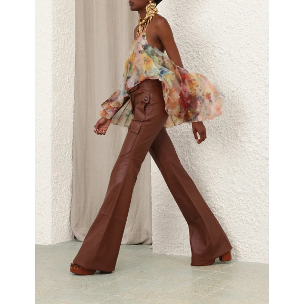 Elevate your elegance in this Zimmermann Tops available now at Coveti