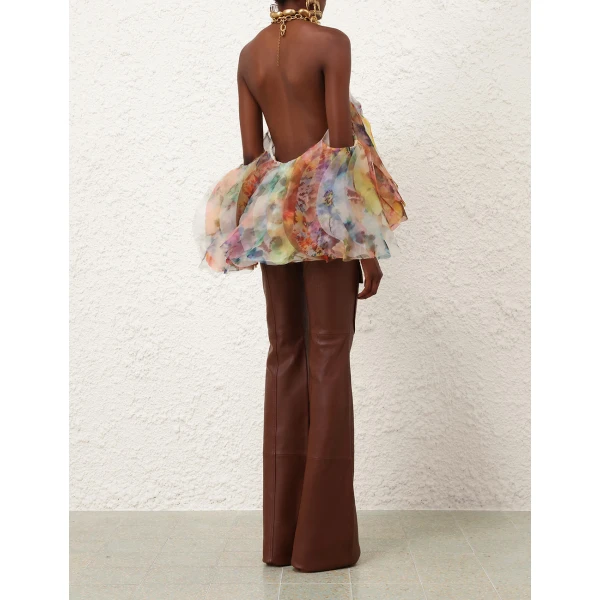 Elevate your elegance in this Zimmermann Tops available now at Coveti