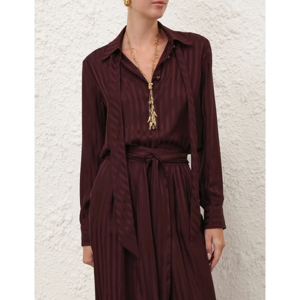 Elevate your elegance in this Zimmermann Tops available now at Coveti