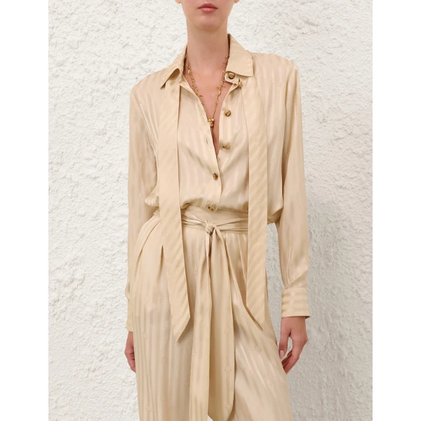 Elevate your elegance in this Zimmermann Tops available now at Coveti