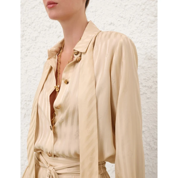 Elevate your elegance in this Zimmermann Tops available now at Coveti