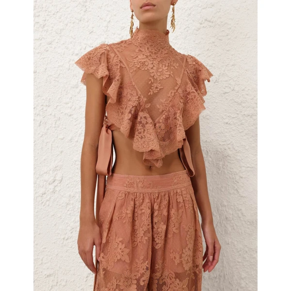 Elevate your elegance in this Zimmermann Tops available now at Coveti