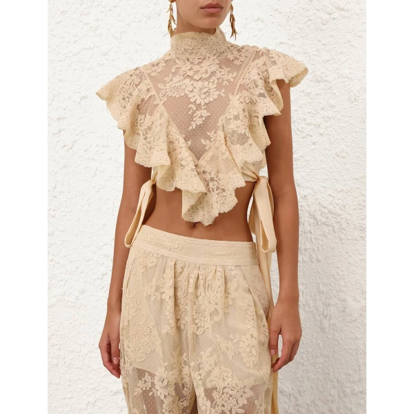 Elevate your elegance in this Zimmermann Tops available now at Coveti