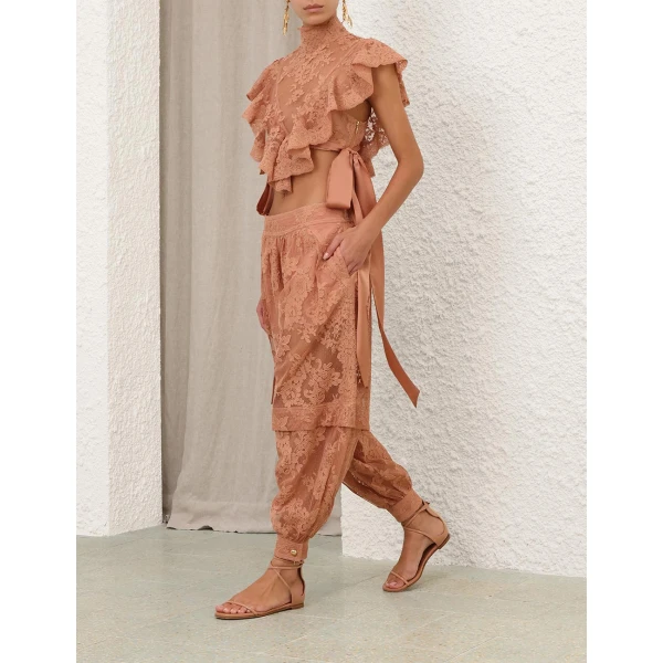 Elevate your elegance in this Zimmermann Tops available now at Coveti