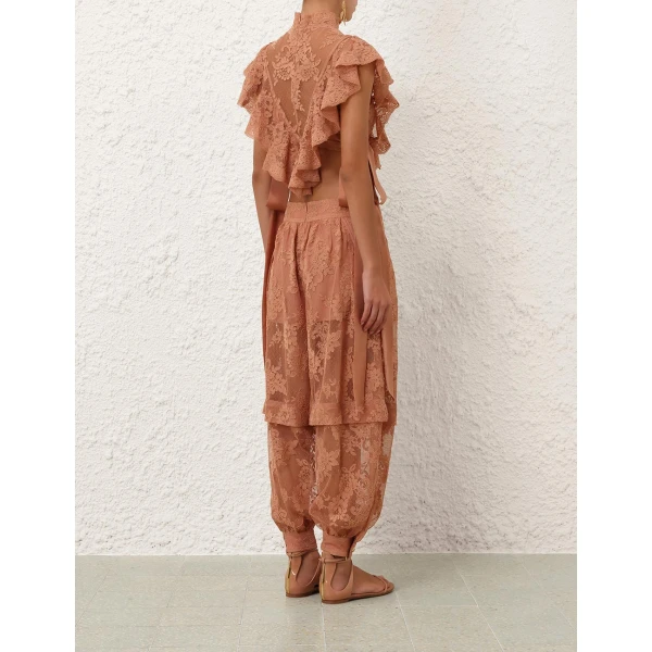 Elevate your elegance in this Zimmermann Tops available now at Coveti