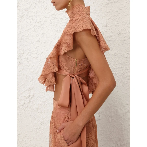 Elevate your elegance in this Zimmermann Tops available now at Coveti