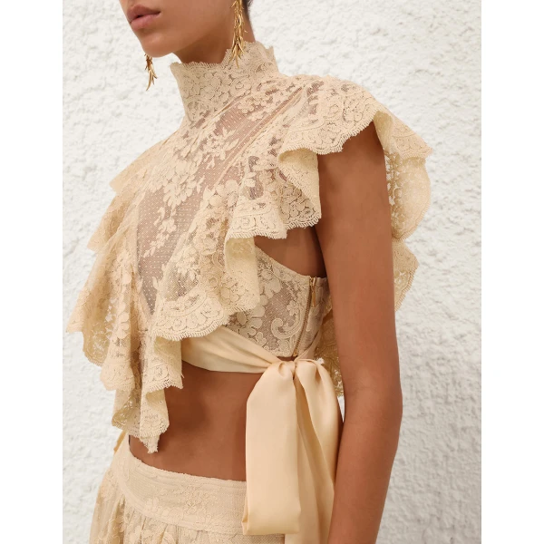 Elevate your elegance in this Zimmermann Tops available now at Coveti