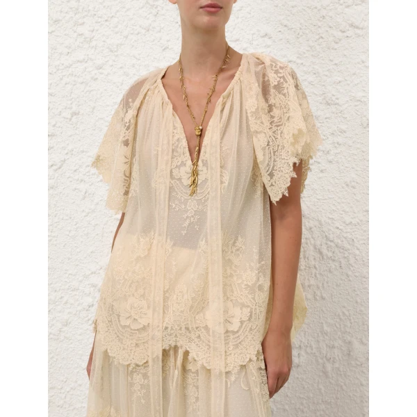 Elevate your elegance in this Zimmermann Tops available now at Coveti