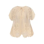Elevate your elegance in this Zimmermann Tops available now at Coveti