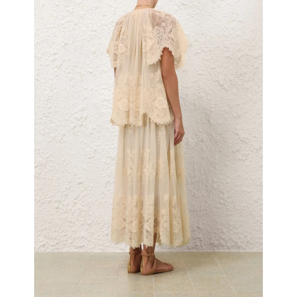 Elevate your elegance in this Zimmermann Tops available now at Coveti