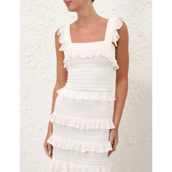 Elevate your elegance in this Zimmermann Tops available now at Coveti