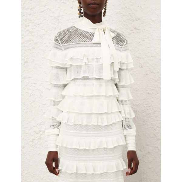 Elevate your elegance in this Zimmermann Tops available now at Coveti