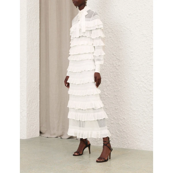 Elevate your elegance in this Zimmermann Tops available now at Coveti