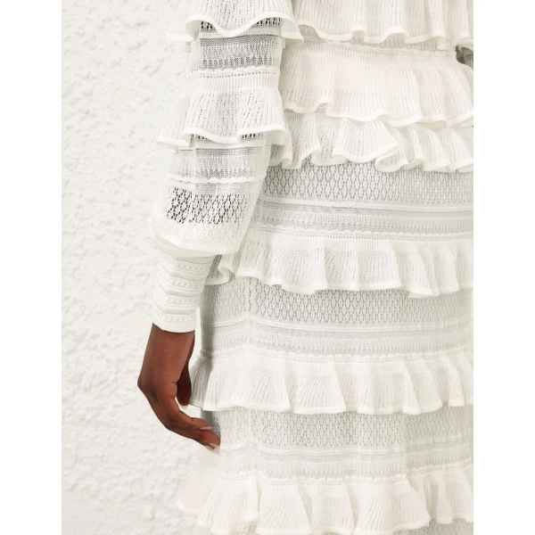 Elevate your elegance in this Zimmermann Tops available now at Coveti