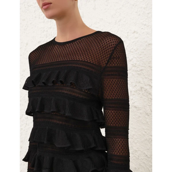 Elevate your elegance in this Zimmermann Tops available now at Coveti