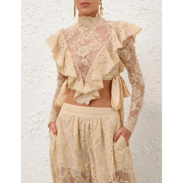 Elevate your elegance in this Zimmermann Tops available now at Coveti