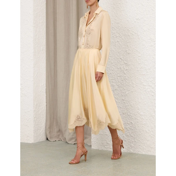 Elevate your elegance in this Zimmermann Tops available now at Coveti