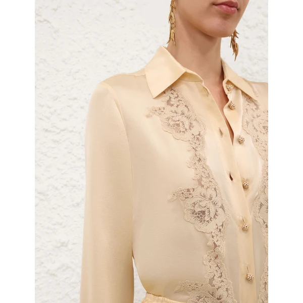 Elevate your elegance in this Zimmermann Tops available now at Coveti