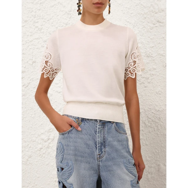 Elevate your elegance in this Zimmermann Tops available now at Coveti
