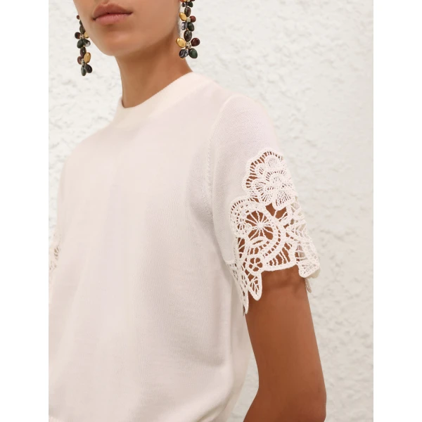 Elevate your elegance in this Zimmermann Tops available now at Coveti
