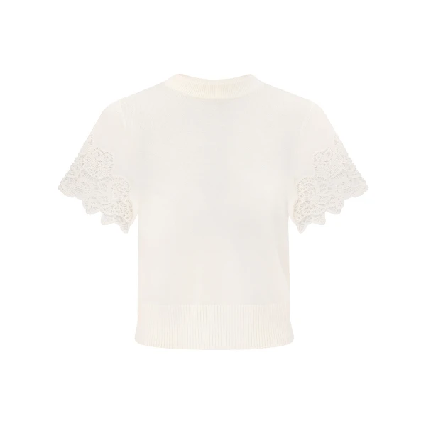 Elevate your elegance in this Zimmermann Tops available now at Coveti