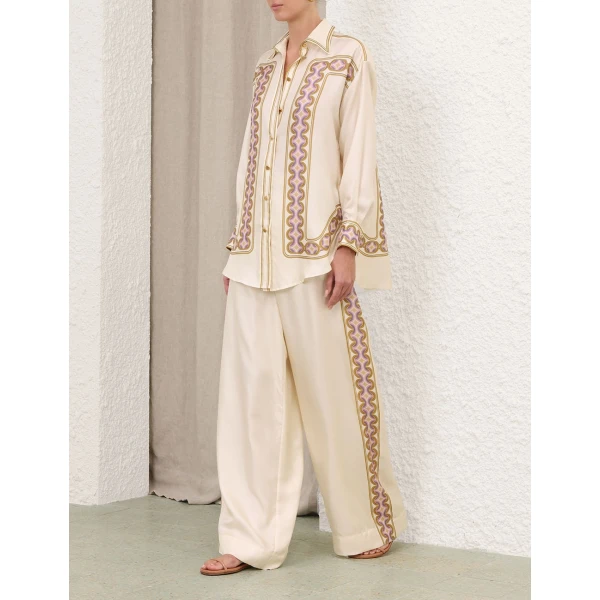 Elevate your elegance in this Zimmermann Tops available now at Coveti