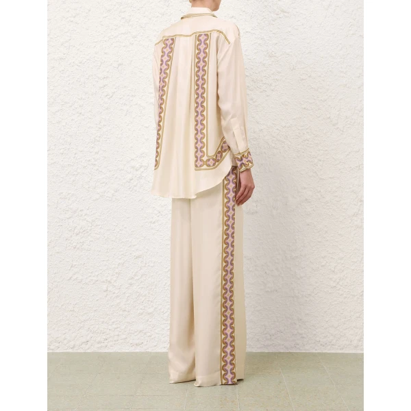 Elevate your elegance in this Zimmermann Tops available now at Coveti