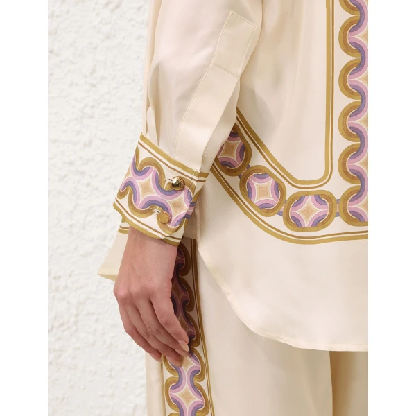 Elevate your elegance in this Zimmermann Tops available now at Coveti