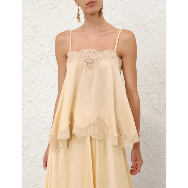 Elevate your elegance in this Zimmermann Tops available now at Coveti