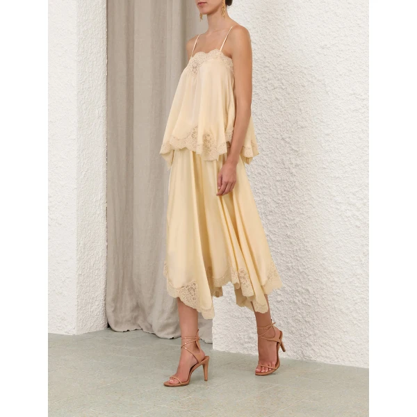 Elevate your elegance in this Zimmermann Tops available now at Coveti