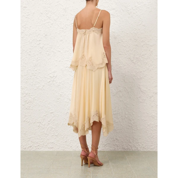 Elevate your elegance in this Zimmermann Tops available now at Coveti