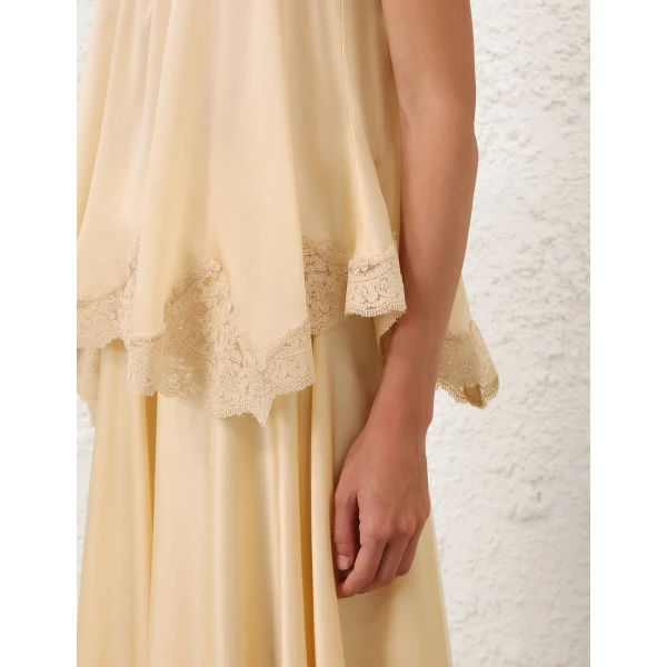 Elevate your elegance in this Zimmermann Tops available now at Coveti