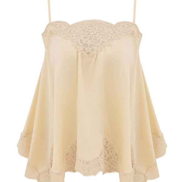 Elevate your elegance in this Zimmermann Tops available now at Coveti
