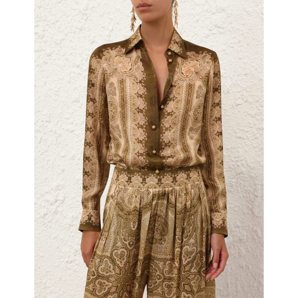 Elevate your elegance in this Zimmermann Tops available now at Coveti