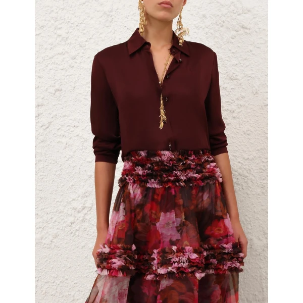 Elevate your elegance in this Zimmermann Tops available now at Coveti