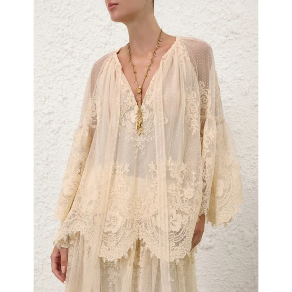 Elevate your elegance in this Zimmermann Tops available now at Coveti