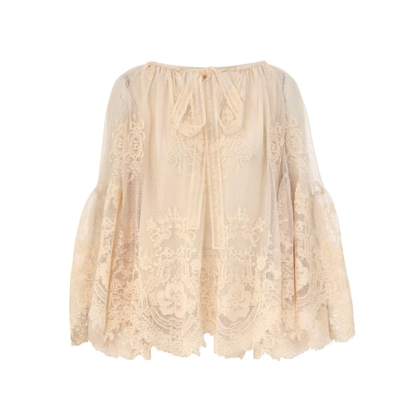 Elevate your elegance in this Zimmermann Tops available now at Coveti
