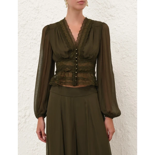 Elevate your elegance in this Zimmermann Tops available now at Coveti