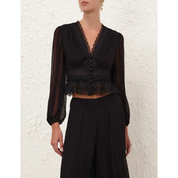 Elevate your elegance in this Zimmermann Tops available now at Coveti
