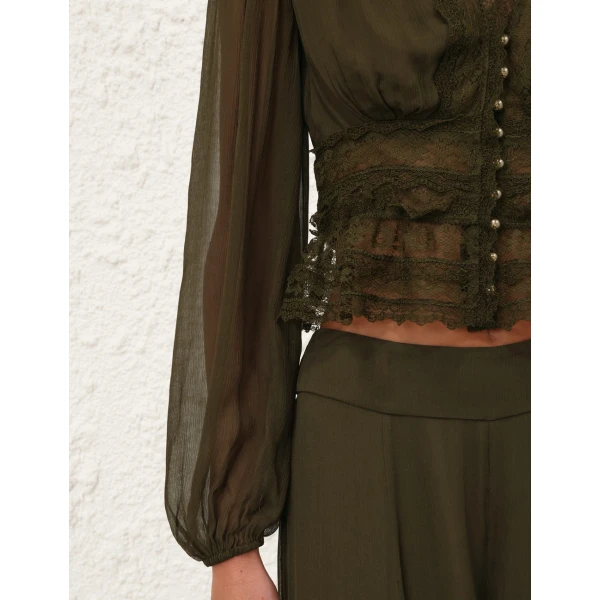 Elevate your elegance in this Zimmermann Tops available now at Coveti