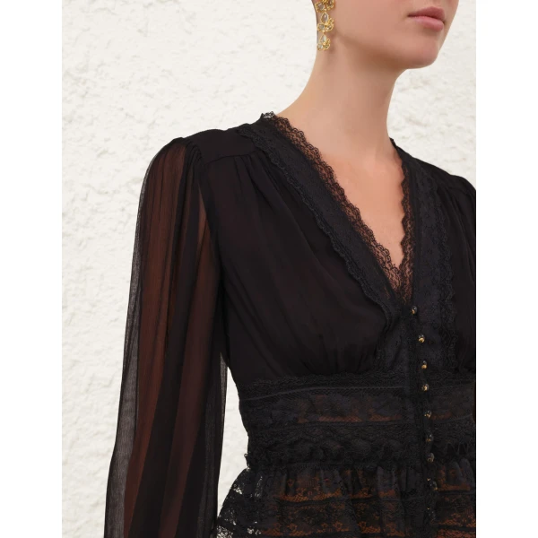 Elevate your elegance in this Zimmermann Tops available now at Coveti
