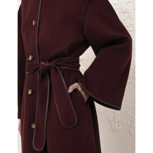Elevate your elegance in this Zimmermann Coats available now at Coveti