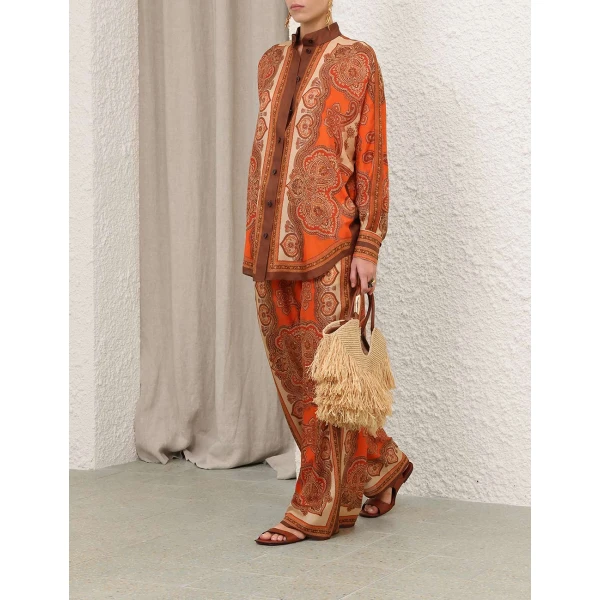 Elevate your elegance in this Zimmermann Tops available now at Coveti