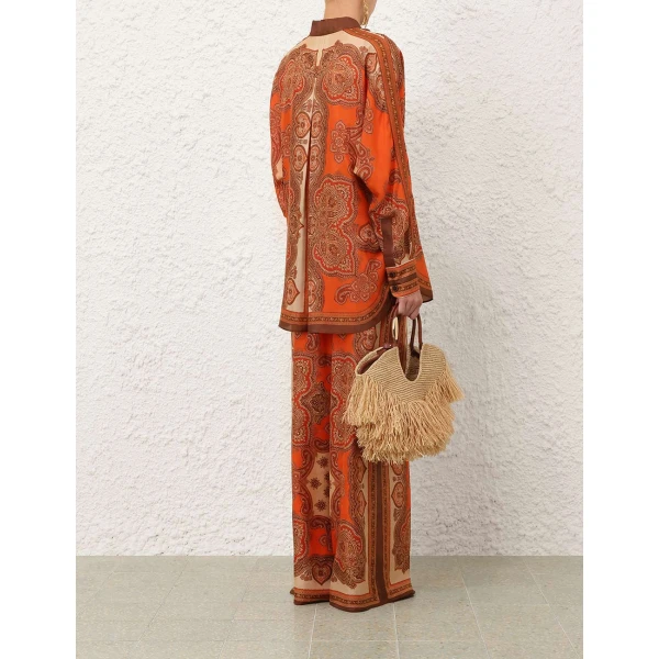 Elevate your elegance in this Zimmermann Tops available now at Coveti