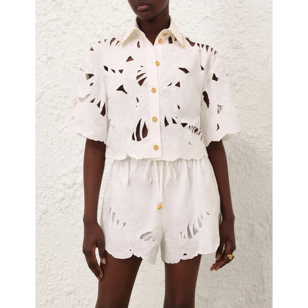 Elevate your elegance in this Zimmermann Tops available now at Coveti