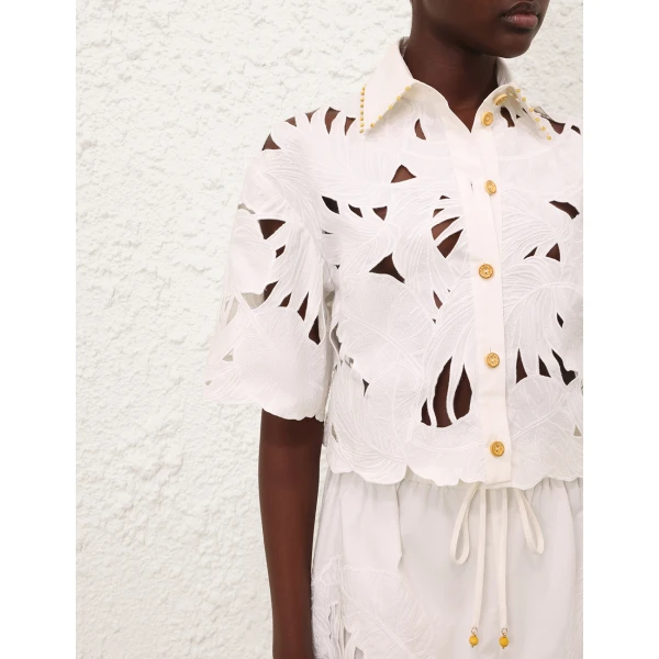 Elevate your elegance in this Zimmermann Tops available now at Coveti