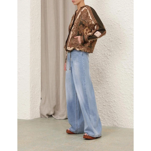 Elevate your elegance in this Zimmermann Tops available now at Coveti