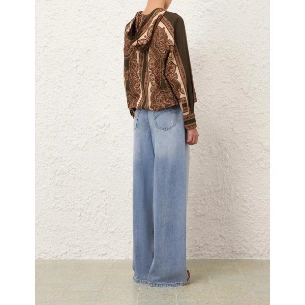 Elevate your elegance in this Zimmermann Tops available now at Coveti