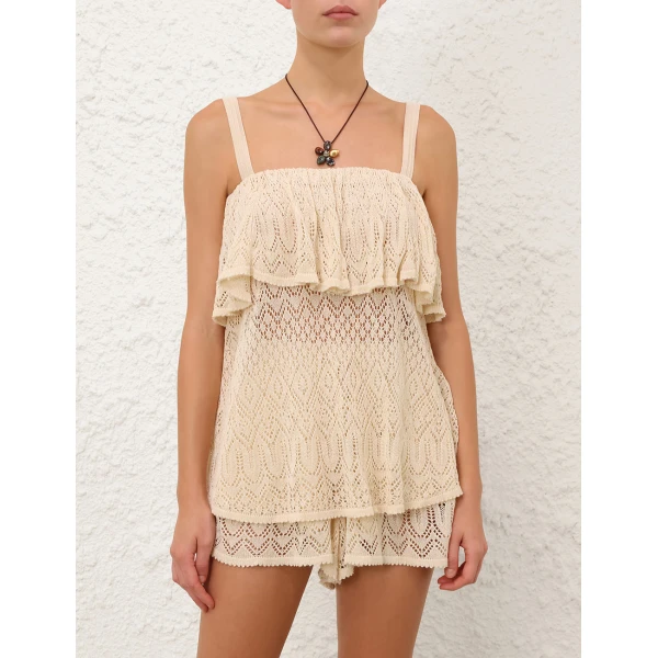 Elevate your elegance in this Zimmermann Tops available now at Coveti