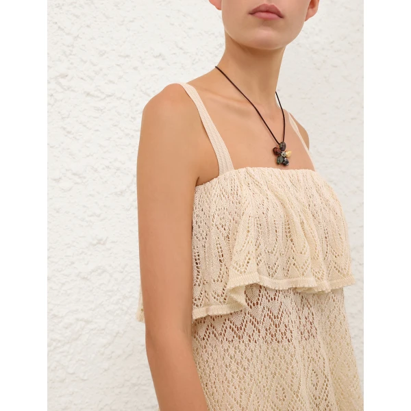 Elevate your elegance in this Zimmermann Tops available now at Coveti